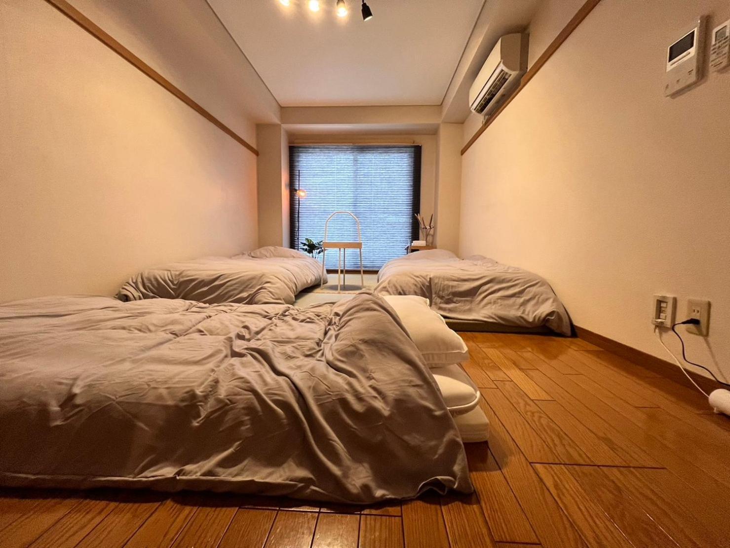 東横のヨコ Apartamento Okayama Quarto foto